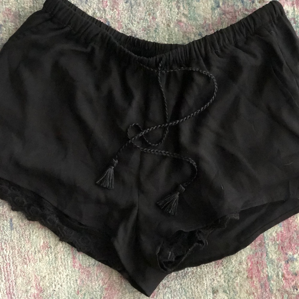 Cute black shorts with lace underlay, tassel tie!